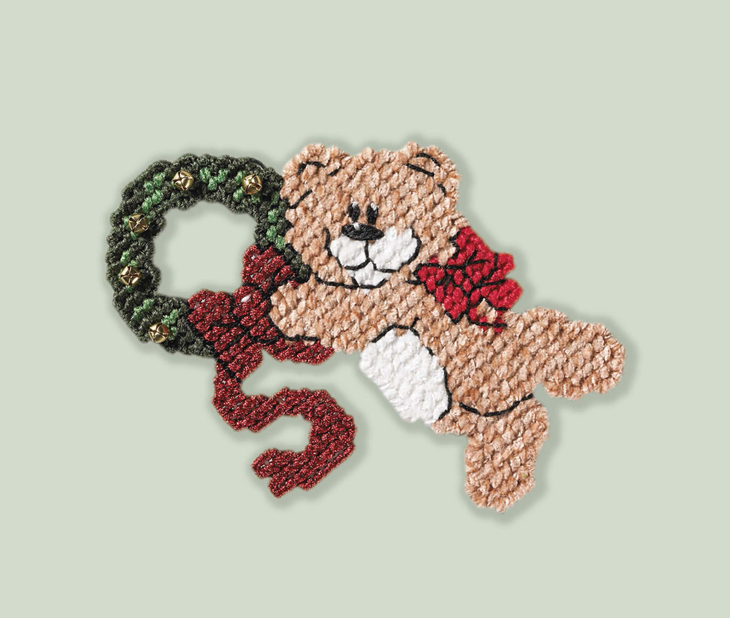Perfect for holiday crafts, Leisure Arts’ “Santa, Bears, & Bells in Plastic Canvas” kit features a beginner-friendly teddy bear with a red bow holding a green wreath with a red ribbon on a light green background.