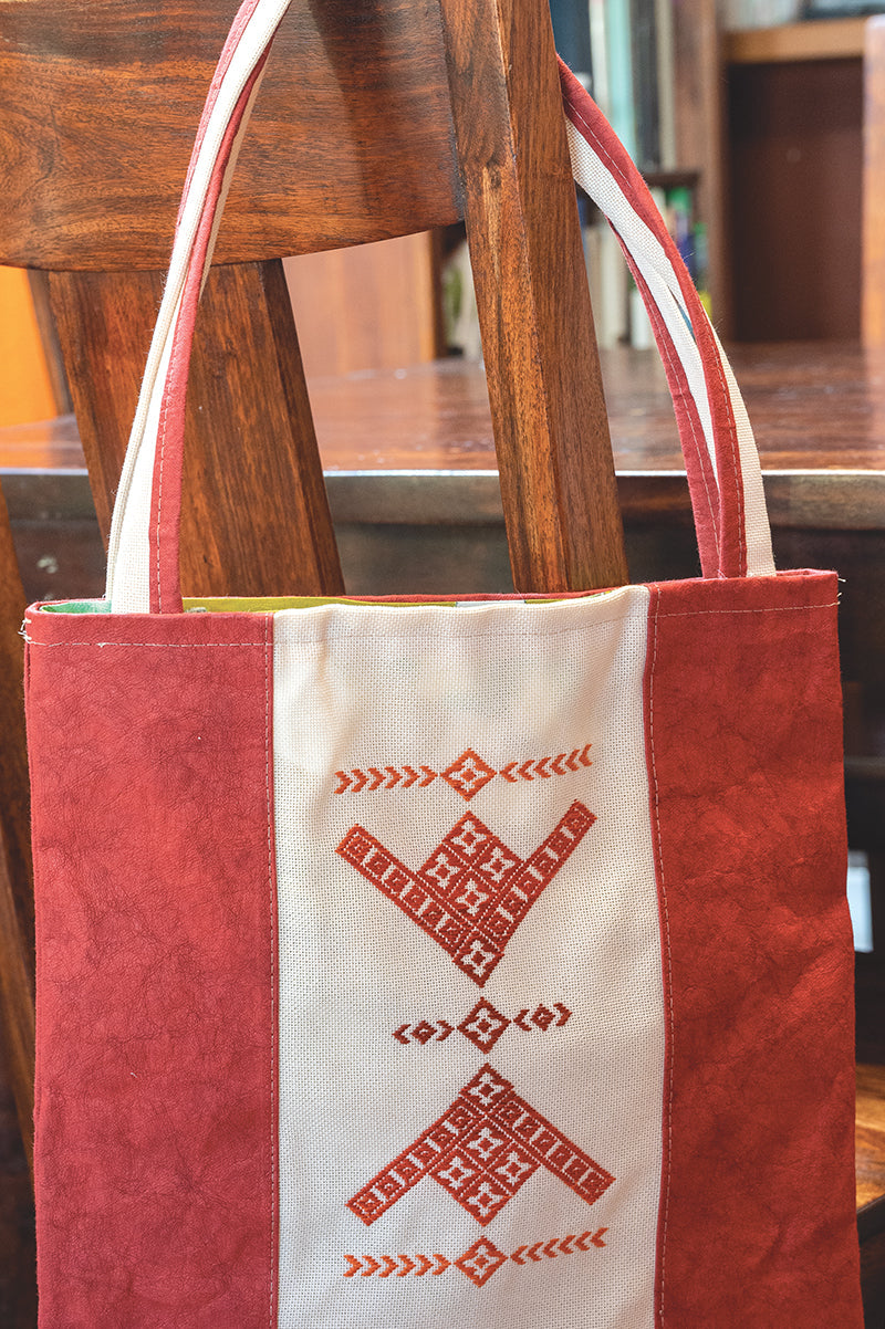 A digital download titled "Contemporary Kogin-zashi" by Stash Books, featuring traditional geometric embroidery in orange, red, and white inspired by Kogin-zashi stitching.