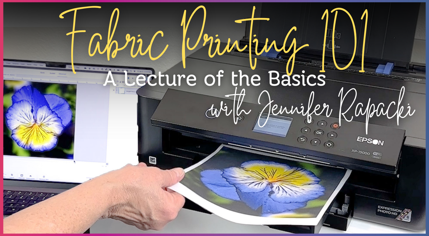 Someone pulls printed fabric with a blue and yellow pansy design from an Epson printer, demonstrating inkjet fabric printing. A computer shows the same image. Text overlay: Creative Spark - Fabric Printing 101: A Lecture of the Basics.