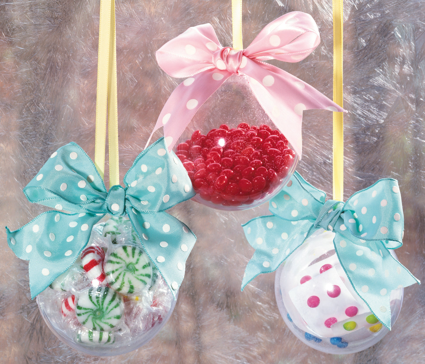 Download the Holiday Ornaments Digital Download by Leisure Arts to create clear ornaments hung on yellow ribbons and filled with candy. Decorate each with a polka dot bow—choose red beads with pink, peppermint with blue, or candy dots with blue.