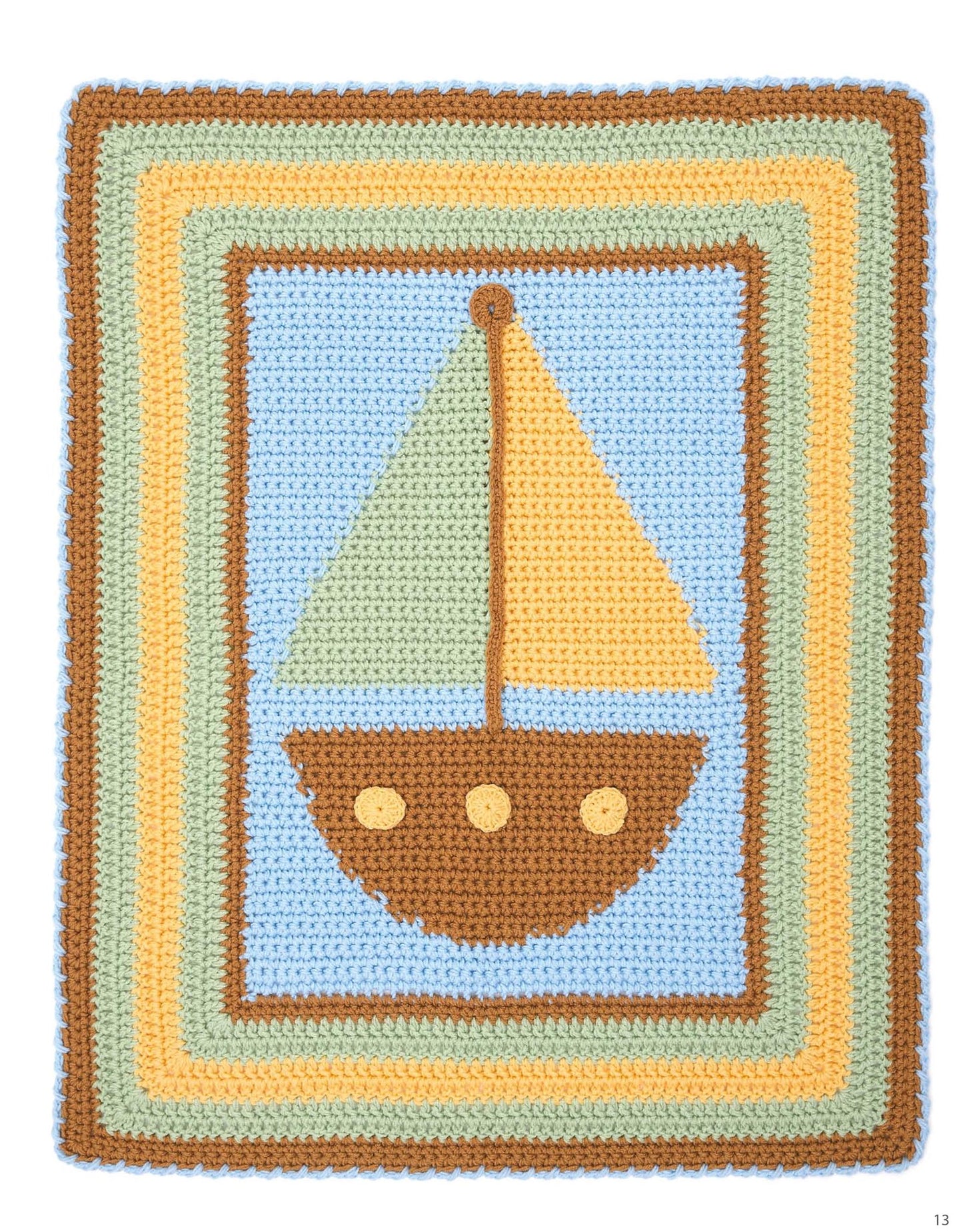 The Modern Nursery Baby Blankets Digital Download by Leisure Arts features a cute crocheted blanket with a brown sailboat and yellow sail on a blue background, bordered by colorful stripes—perfect for beginner crochet and kids' rooms.