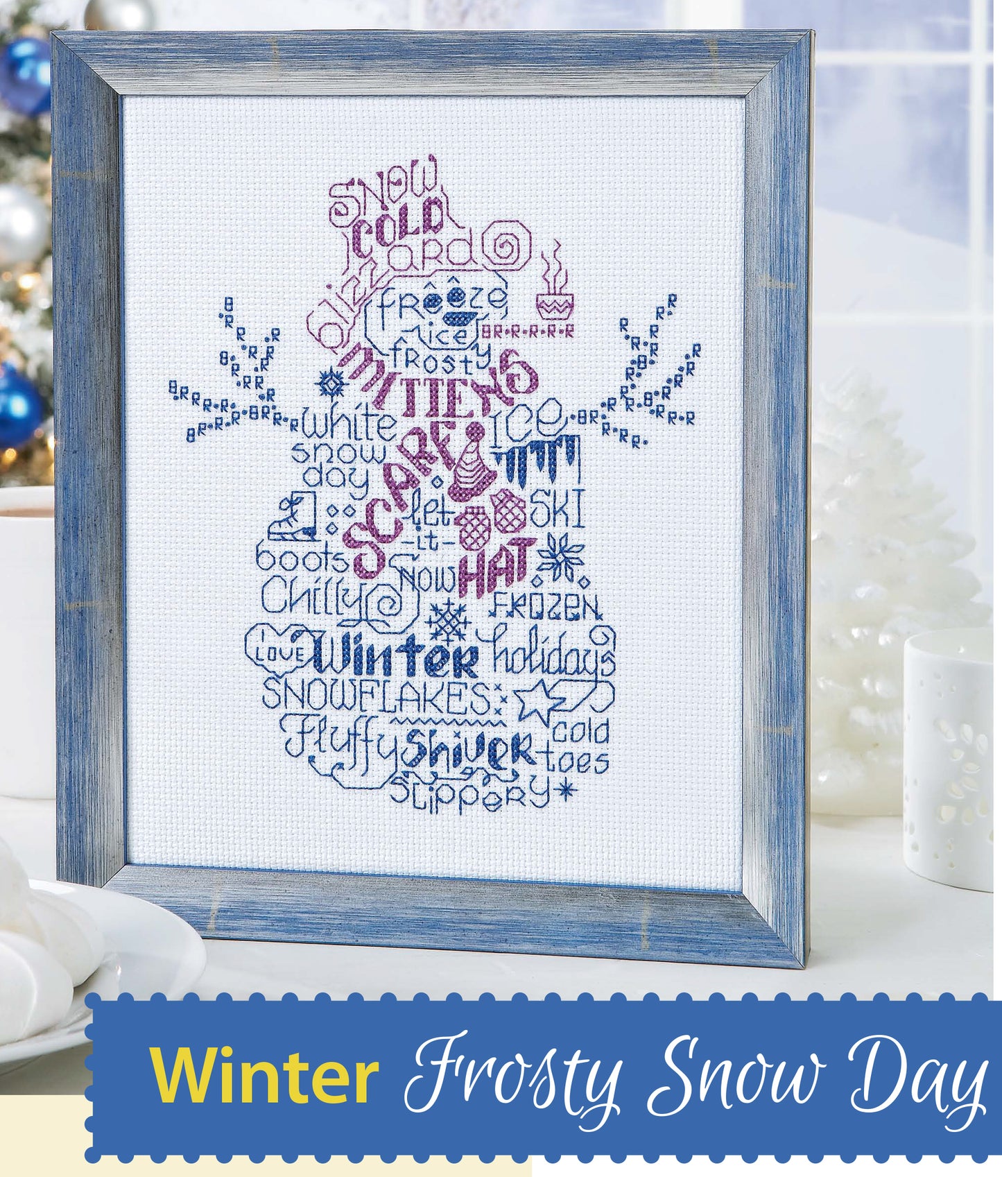 Leisure Arts’ Seasonal Wordplay Cross Stitch Digital Download features a snowman in blue and purple winter words on 14 count Aida, with “Winter Frosty Snow Day” at the bottom—perfect for home decor.