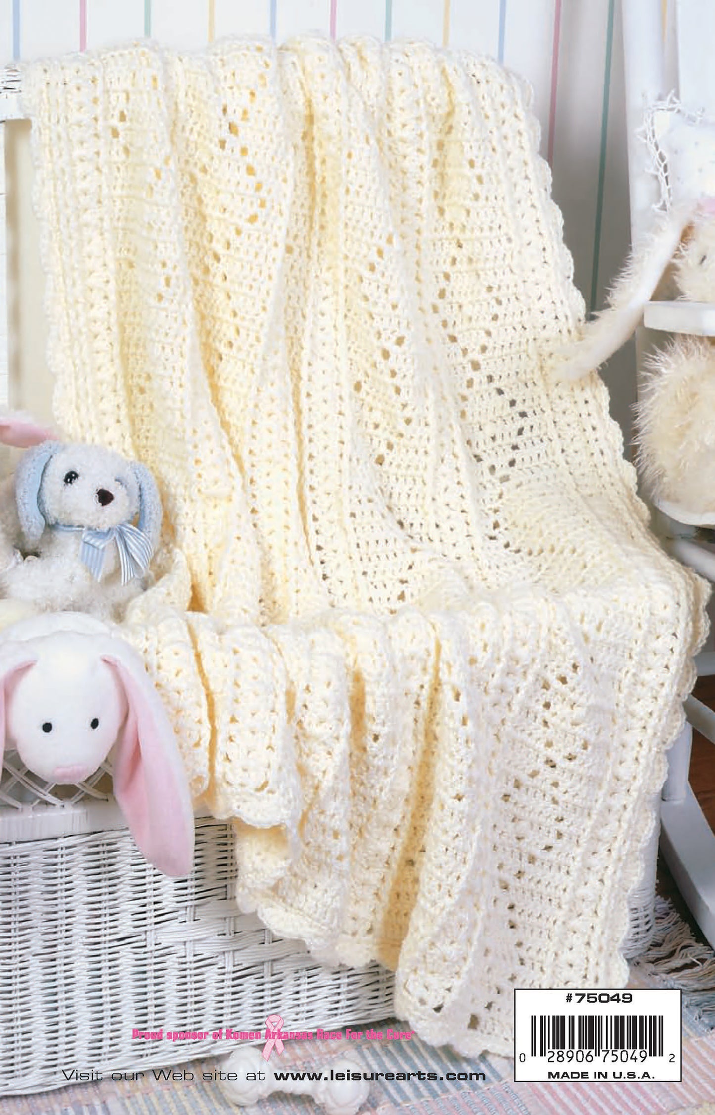Leisure Arts Nursery Favorites: A soft, cream crochet afghan draped over a white wicker chair with white and light pink stuffed bunnies—ideal for baby gifts. The barcode appears at the bottom right.
