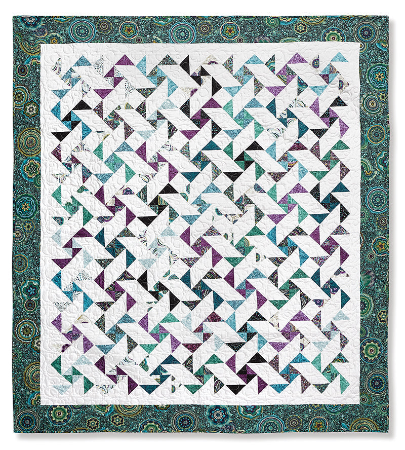The Quilter's 2-1/2" Strip Precut Companion by C&T Publishing is ideal for beginners, helping you create a colorful pinwheel quilt in white, teal, purple, and dark blue with dynamic geometric patterns and a wide teal-green border.