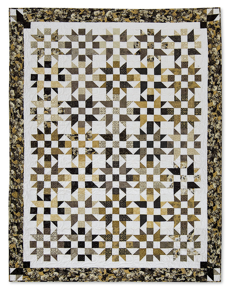 The Quilter's 2-1/2" Strip Precut Companion by C&T Publishing features a handmade quilt with interlocking star and cross shapes in black, white, and gold floral fabrics, inspired by Jelly Roll patterns and finished with floral borders.