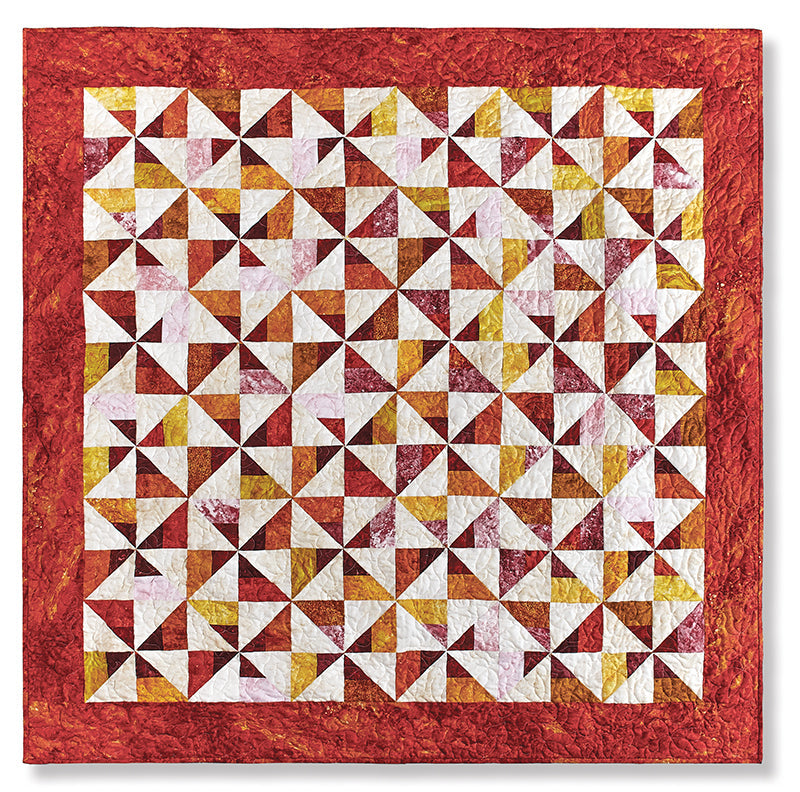 Create a square quilt with red borders and geometric pinwheel patterns in white, yellow, and red using Quilter's 2-1/2" Strip Precut Companion by C&T Publishing—perfect for beginner quilters.