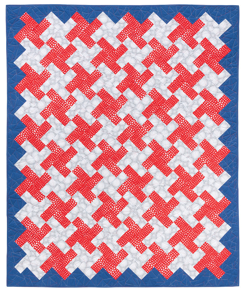 The "How Do I Quilt It?" quilt from Stash Books features interlocking red and white X-shapes in assorted red prints, bordered by solid blue. Modern machine quilting adds texture and highlights the bold geometric pattern.