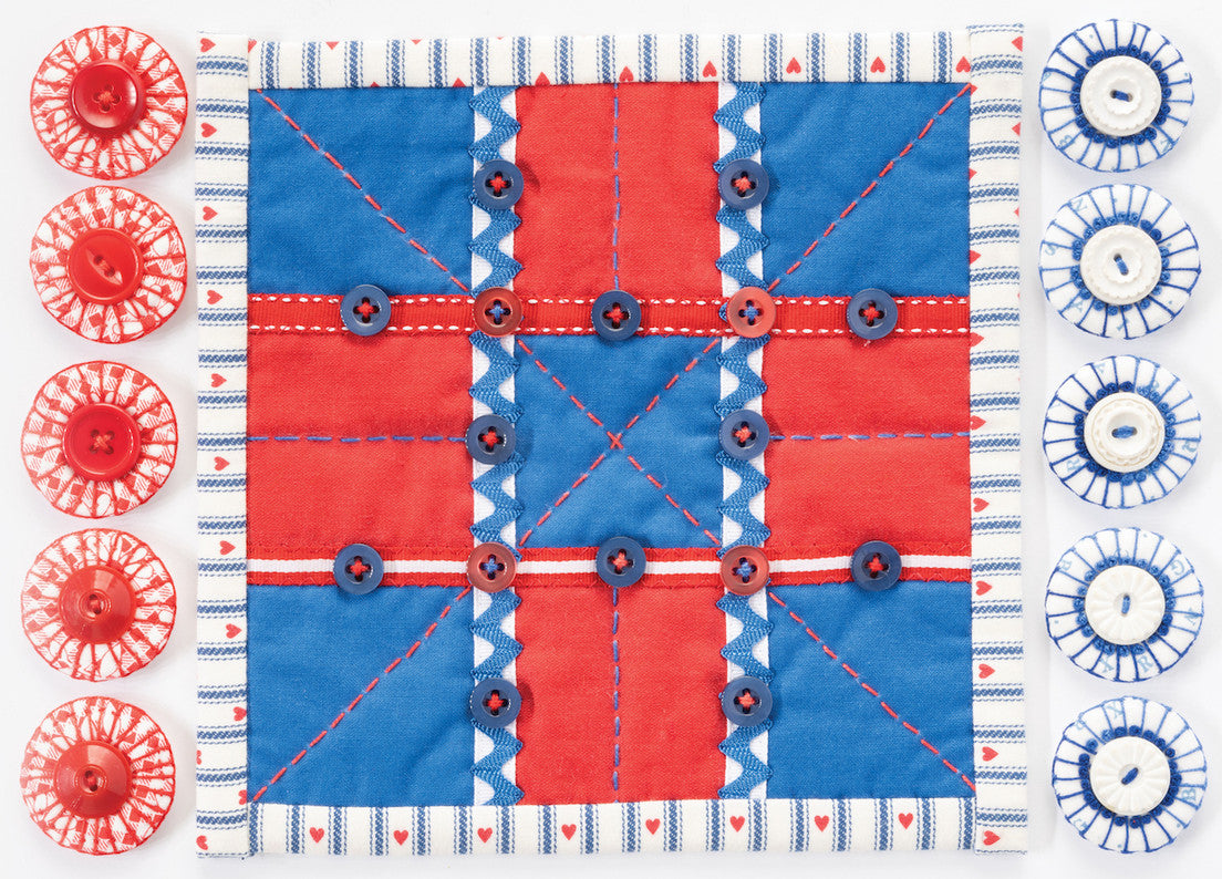 The Free Project Download: Tic Tac Toe Board by Christen Brown from C&T Publishing features a handmade red and blue fabric board with creative embroidery and button pieces—ideal for kids. Includes free downloadable instructions.
