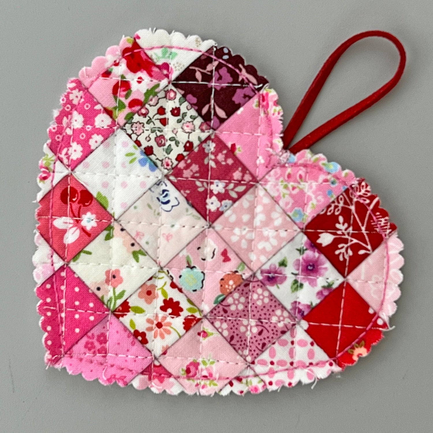 "Stitched with Love: The Quilted Heart” is a Free Valentine's Day Quilted Design Pattern designed by Erin Hentzel from C&T Publishing!
