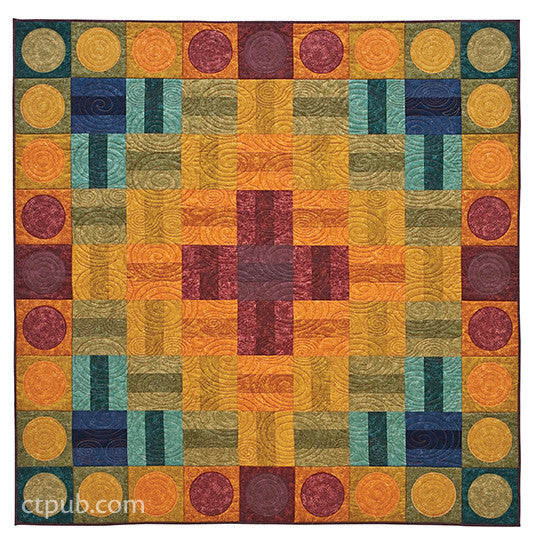 A vibrant quilt from C&T Publishing's "Quilts from Textured Solids" digital download features a central red cross, surrounded by yellow, orange, blue, and green geometric shapes in textured solids on a symmetrical grid. "ctpub.com" appears lower left.