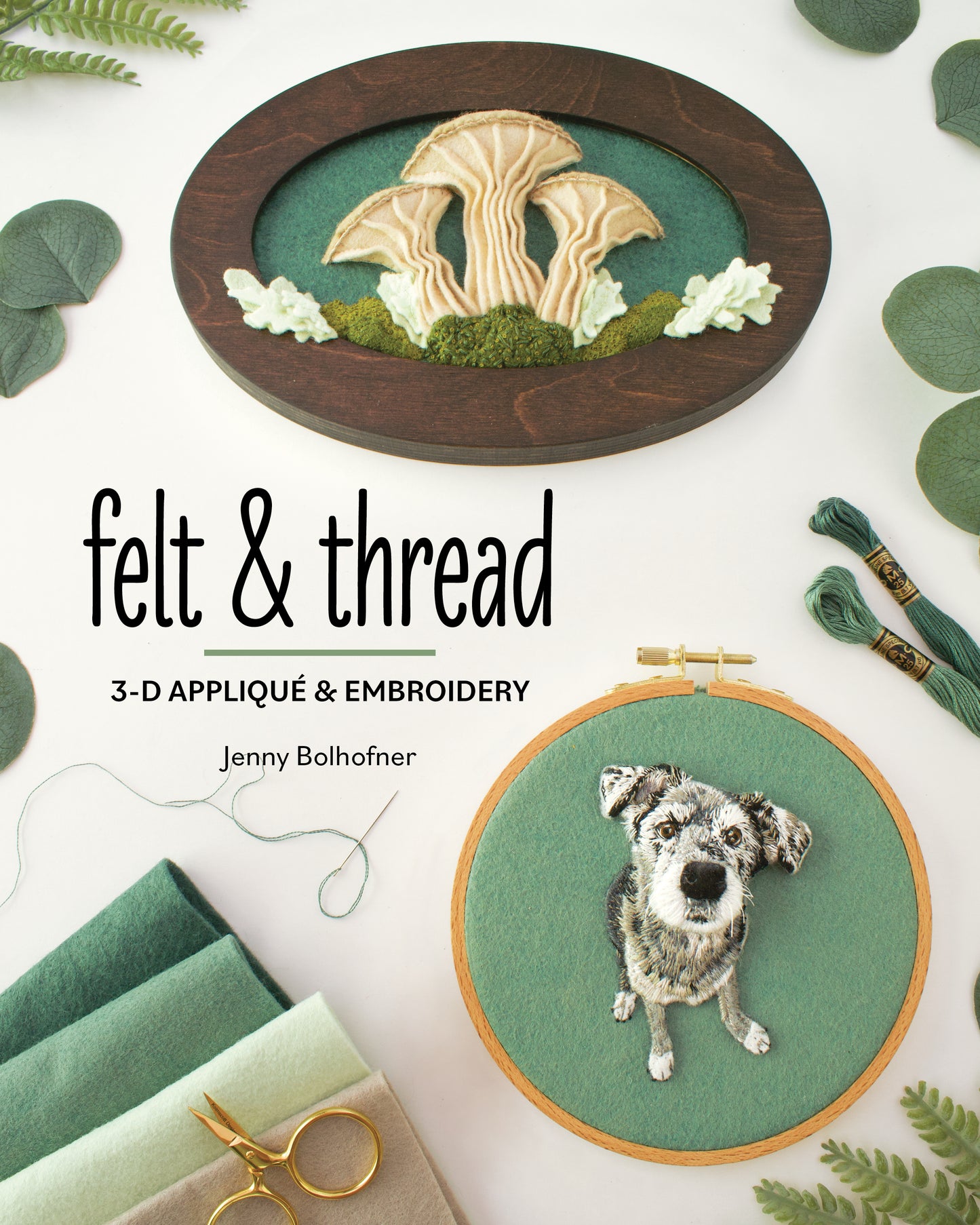 The cover of Felt & Thread by Stash Books features framed felt and thread art—embroidered mushrooms in an oval frame, a dog in a wooden hoop with felt appliqué—plus green floss spools, felt sheets, and scissors.