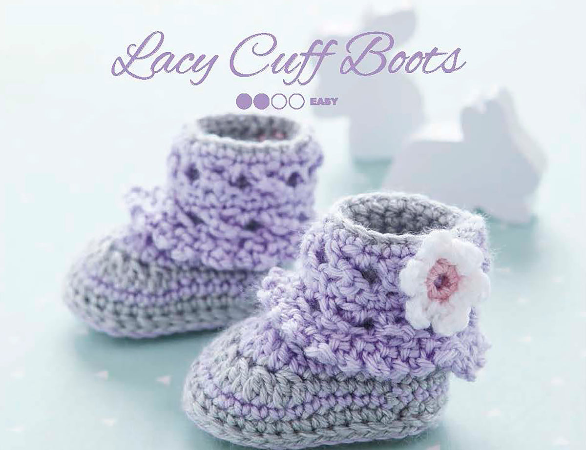 Leisure Arts Modern Booties for Baby: Pastel purple and gray crocheted booties with lacy cuffs and a white flower, shown on a soft blue background with bunny shapes—ideal for beginner crochet fans or those exploring charming designs.