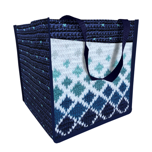 The C&T Publishing Yarn Art Project Tote is a reusable square yarn bag with navy handles and a blue-and-white diamond crochet pattern—ideal as a stylish knitting organizer or project bag.