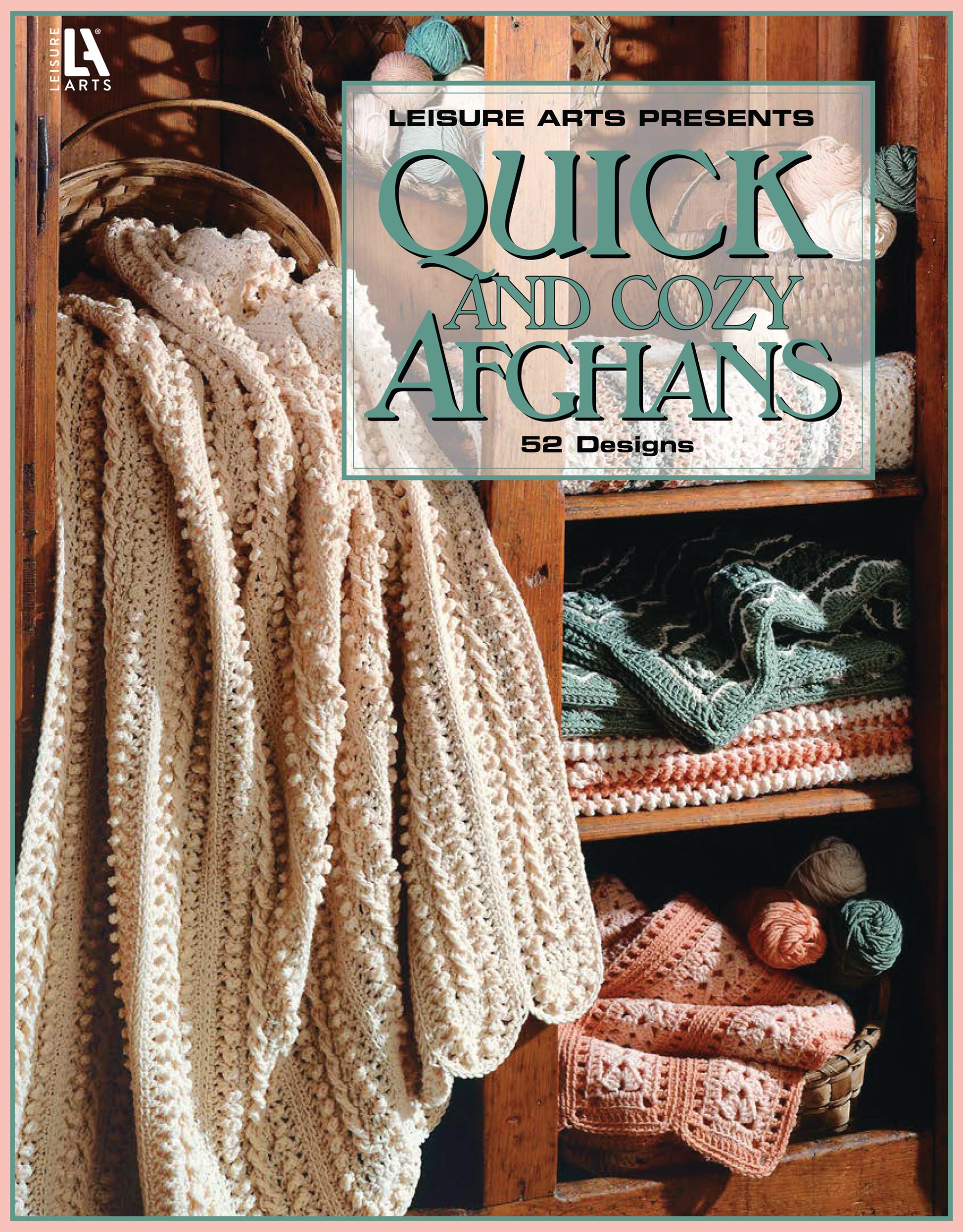 The Quick & Cozy Afghans Digital Download by Leisure Arts features cream, green, and peach crocheted afghan patterns draped on wooden shelves with matching yarn balls below—perfect inspiration for large hook crochet projects.