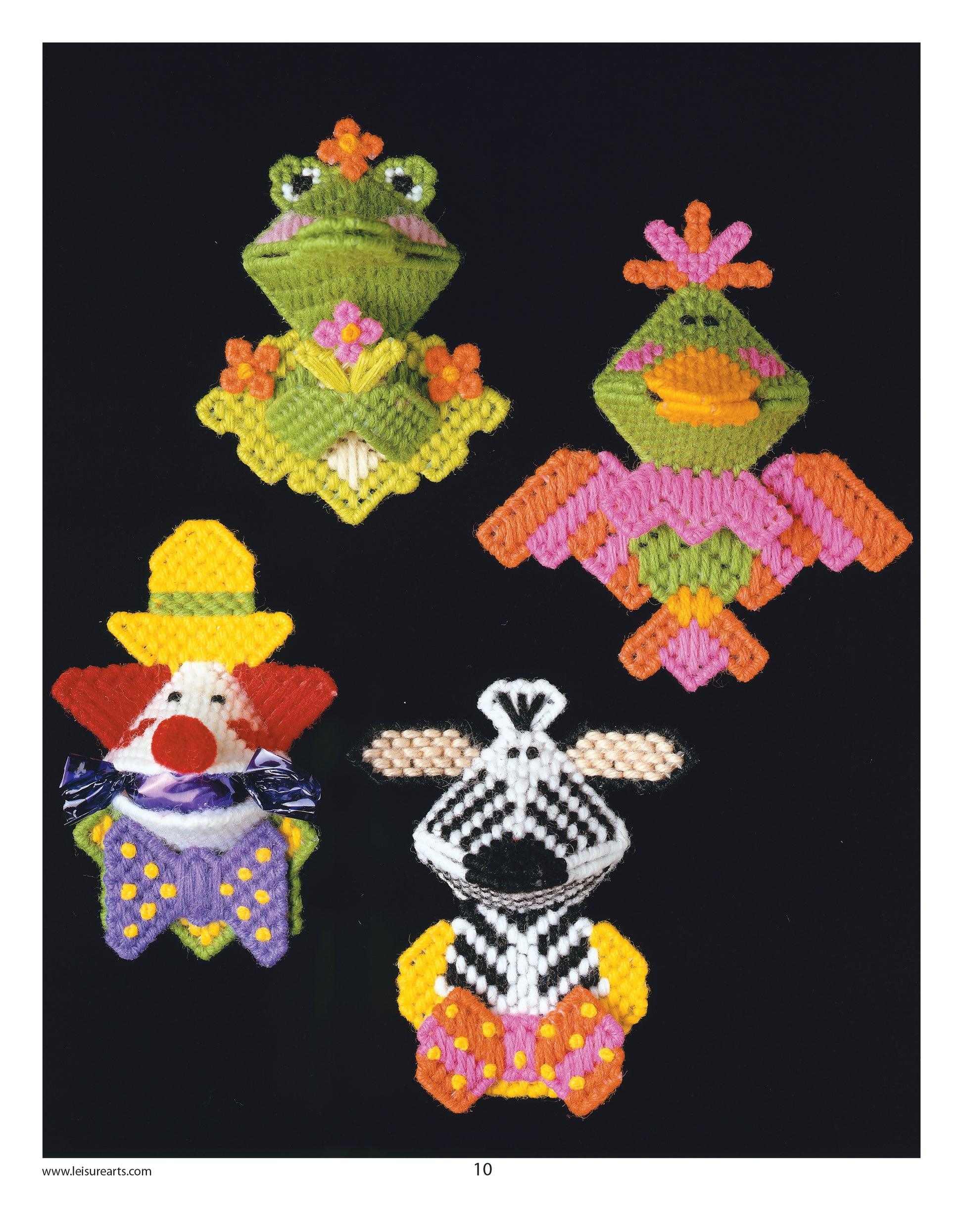 Leisure Arts’ Plastic Canvas Kissers Digital Download features four vibrant beginner magnets: a frog princess, crowned bird, clown with yellow hat and bow tie, and a black-and-white cow with a yellow base on black background.