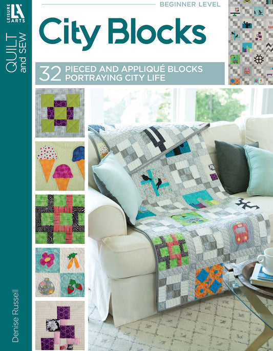 City Blocks—32 Pieced and Applique Blocks Portraying City Life by Leisure Arts displays a city-themed quilt over a white couch, featuring close-ups of ice cream cones, flowers, and geometric shapes—ideal for beginner quilters.