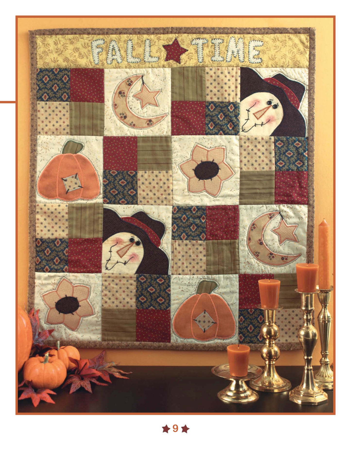 The "Quick & Easy Wall Hangings for the Seasons" digital download from Leisure Arts features a patchwork quilt with scarecrow faces, pumpkins, moons, and flowers with “FALL TIME” stitched above—perfect seasonal décor. Brass candlesticks and pumpkins complete the look.