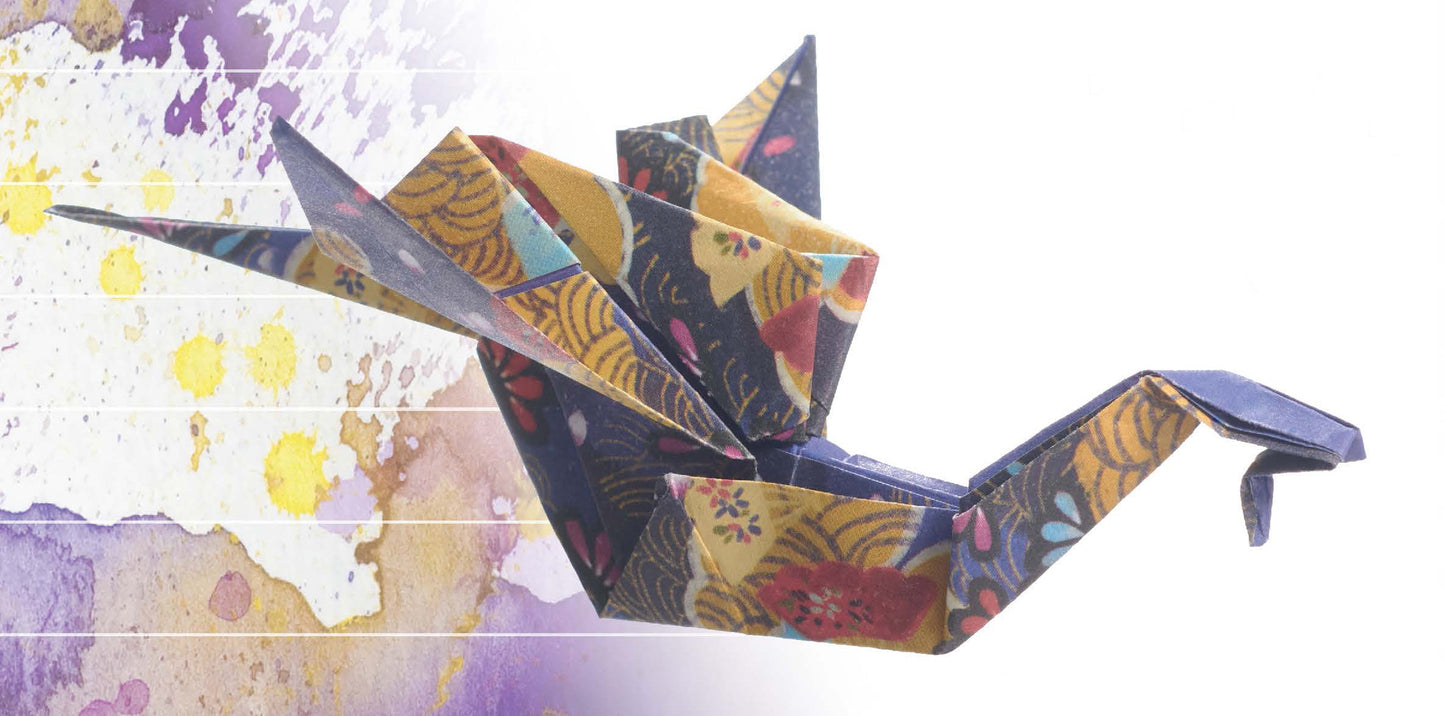 The "Origami Fun" kit by Leisure Arts features a colorful crane folded from patterned paper, set against a purple and yellow watercolor background—perfect inspiration for origami enthusiasts from beginner to advanced.