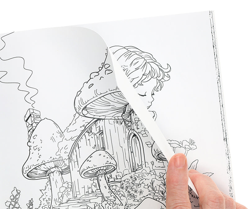 A hand lifts a page in Leisure Arts’ Enchanted Gardens—36 Magical Fantasy Designs for Adult Coloring, showing black and white art of a child with closed eyes, mushrooms, and a whimsical house—ideal for relaxation.