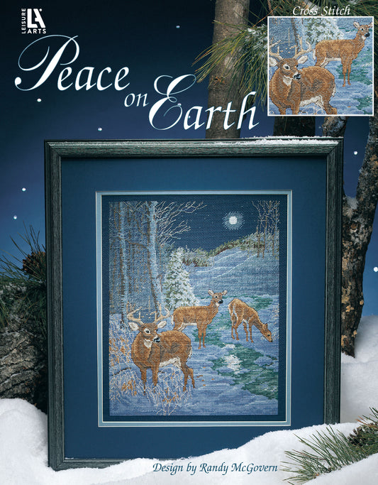 The Peace on Earth Cross Stitch by Leisure Arts features a framed deer in a snowy forest under a full moon with “Peace on Earth” at the top—an ideal holiday gift for nature lovers. Design by Randy McGovern.