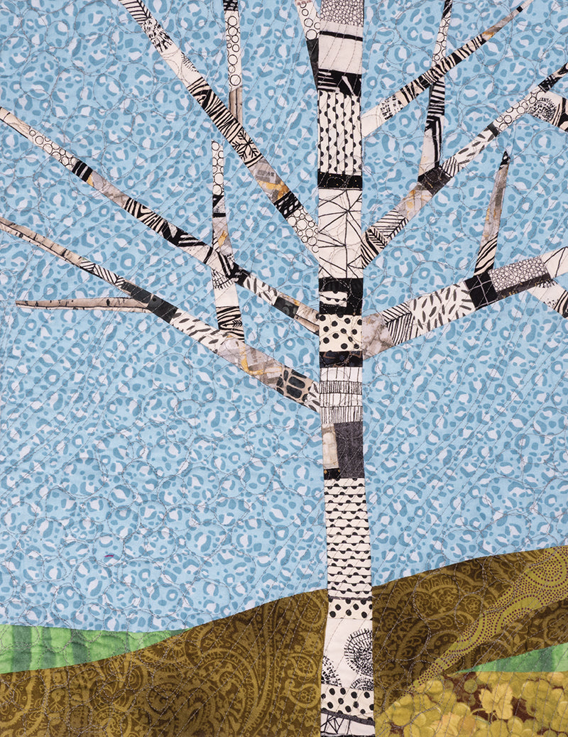 The "Quilt Small, Dream Big" by C&T Publishing features a quilted bare tree with patterned branches on green and brown hills beneath a blue dotted sky—ideal for beginner quilting or trying out miniature piecing techniques.