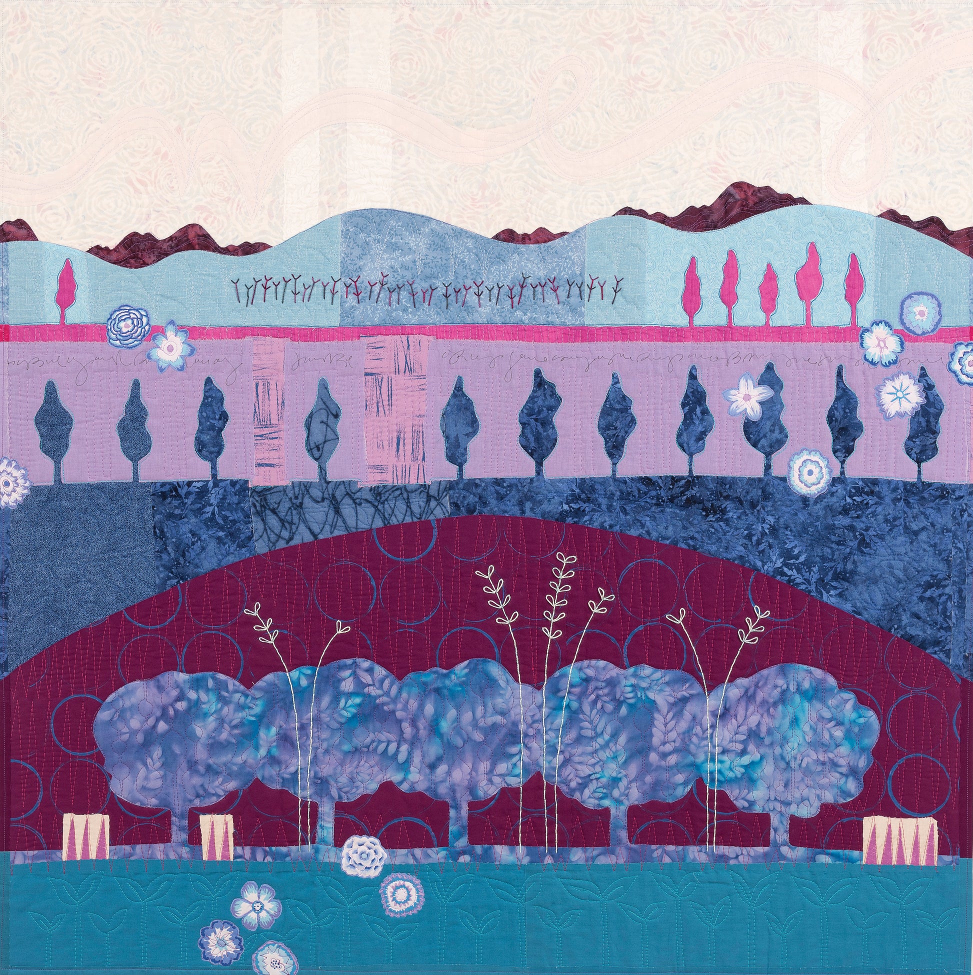The Art Quilt Collage by C&T Publishing is a colorful, abstract textile art landscape with layered hills, stylized trees, and floral patterns in blue, purple, pink, and white, featuring decorative textures and geometric shapes.