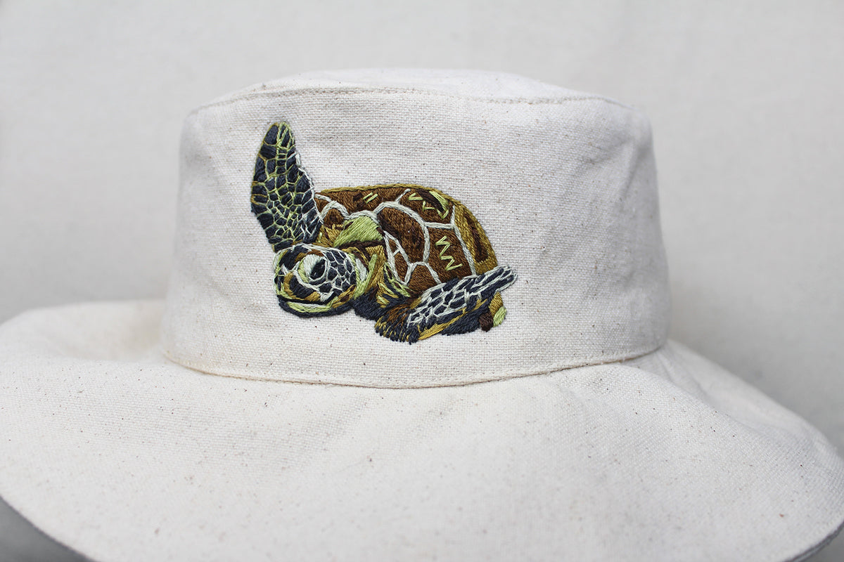 Off-white Wild & Wearable Animal Embroidery bucket hat featuring an embroidered sea turtle.