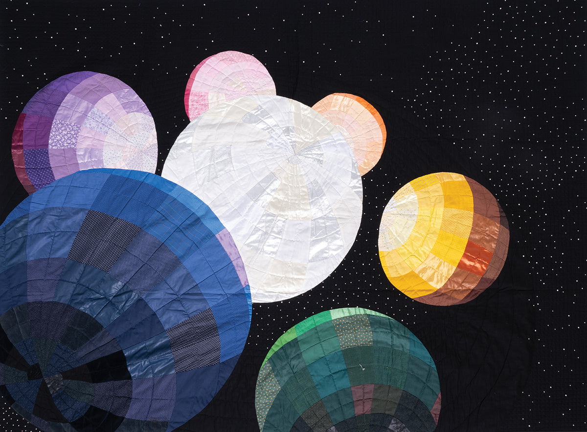 Colorful quilted spheres float in space on a starry black backdrop, echoing the artistry of “Inspiration in Color & Cloth—The Art Quilts of Katie Pasquini” by C&T Publishing.