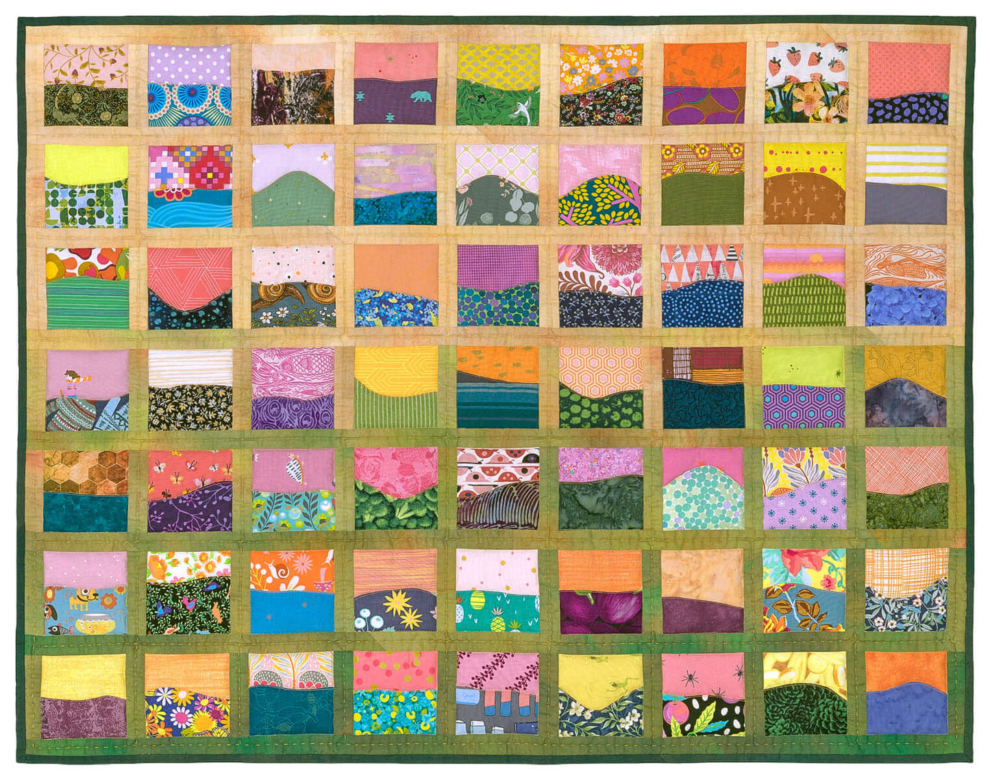 Creative Spark’s "Landscapes as Building Blocks: Quilt the Places You Love with Easy Improv" features scenic quilt inspiration using scrap-friendly techniques, colorful fabrics, and a patchwork design bordered with green and tan strips.