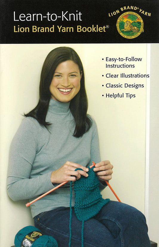 A smiling woman with long brown hair holds knitting needles and teal yarn. Text beside her features "Learn To Knit—Lion Brand Yarn Booklet" by Leisure Arts, offering beginner-friendly patterns, instructions, and helpful tips.