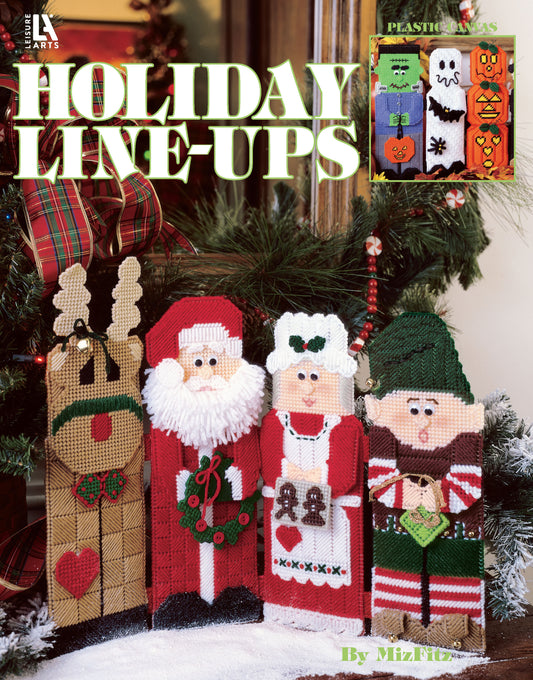 Four charming yarn-crafted figures—a reindeer, Santa, Mrs. Claus, and an elf—stand by a festive fireplace. Find inspiration for beginner baby projects in "Babys Best to Knit and Crochet" from Leisure Arts.