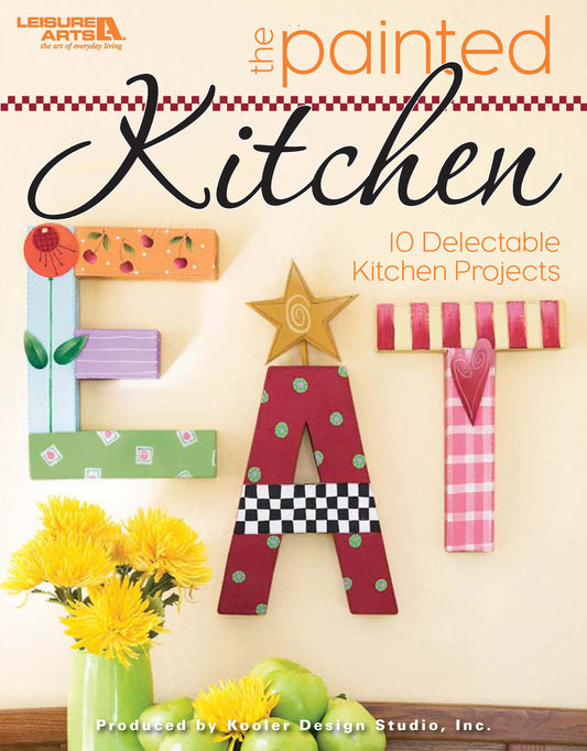 Cover of Leisure Arts’ The Painted Kitchen features vibrant, decorated EAT letters with floral accents and the subtitle "10 Delectable DIY kitchen projects.