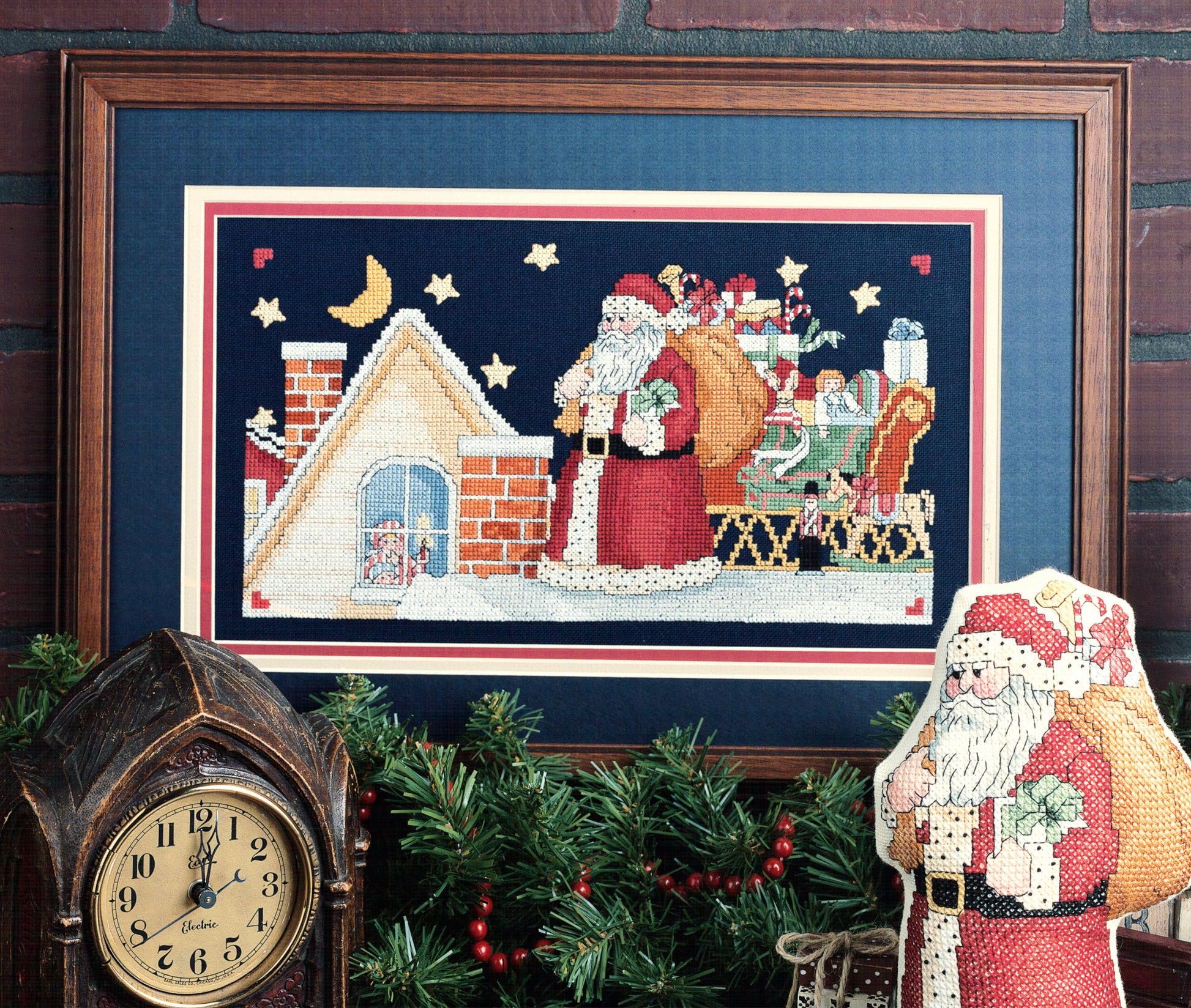 Santa’s Great Book of Cross Stitch by Leisure Arts features charming holiday designs, like Santa with gifts on a roof. Perfect for cross stitchers who love festive traditions and creative Christmas displays.