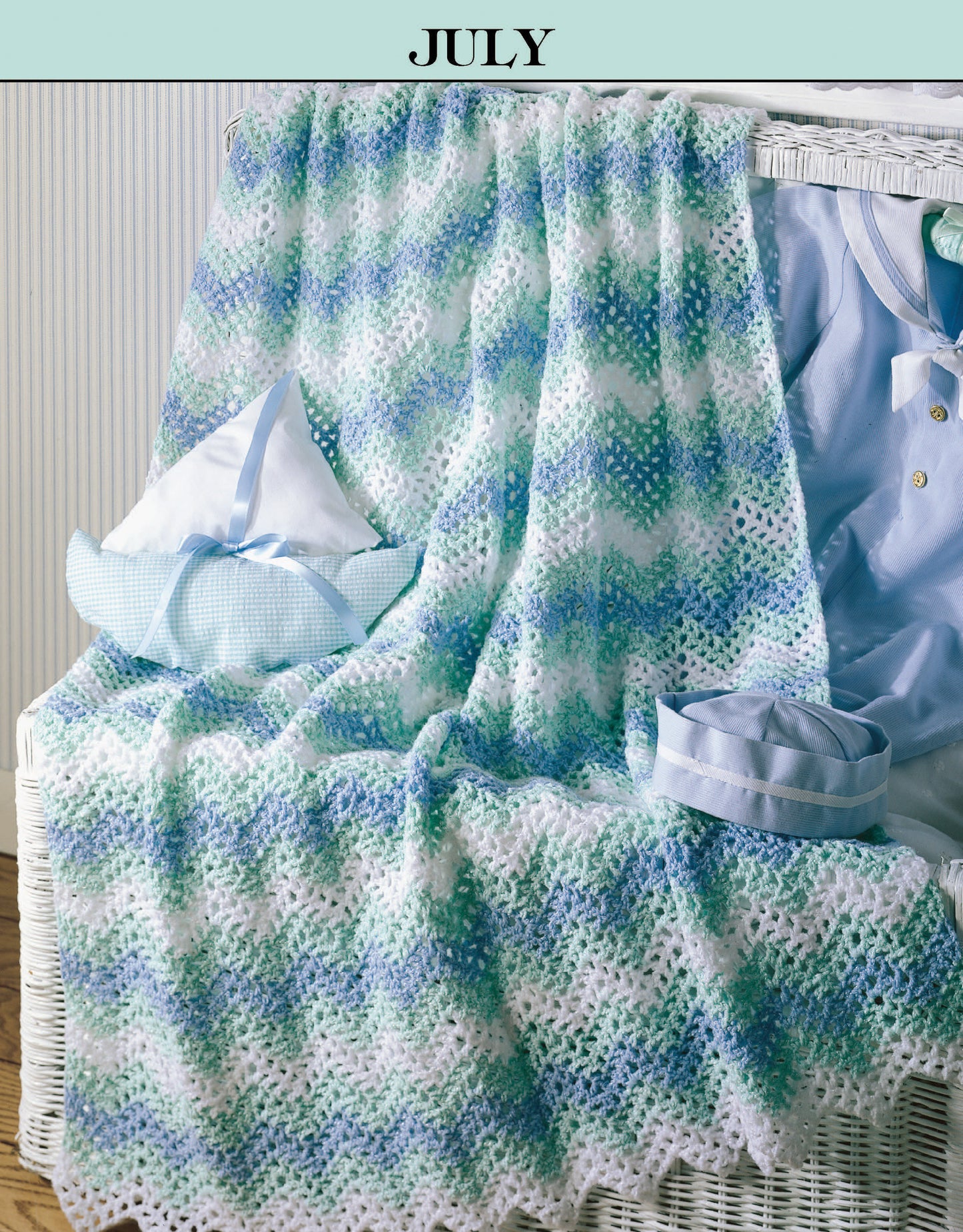 A Year of Baby Afghans, Book 2 by Leisure Arts features cozy, wavy-patterned knit baby blankets in blue, green, and white—ideal for those seeking seasonal crochet afghan patterns.