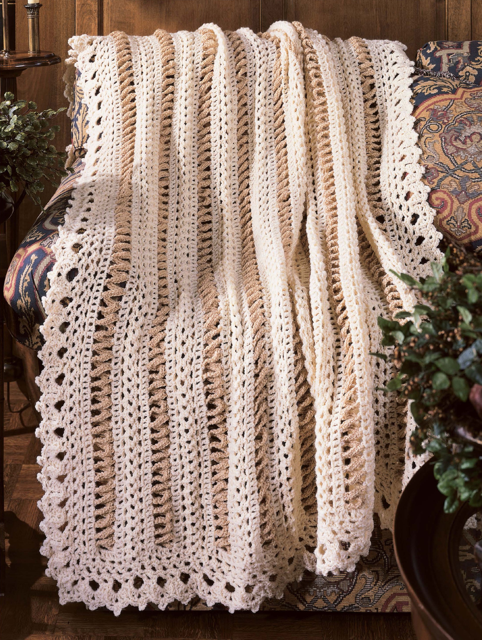 The Best of Terry Kimbrough Afghans Digital Download by Leisure Arts features patterns for cream-colored, lacy, crocheted blankets—ideal for Victorian lace projects to accent chairs or cozy spaces with elegant texture.