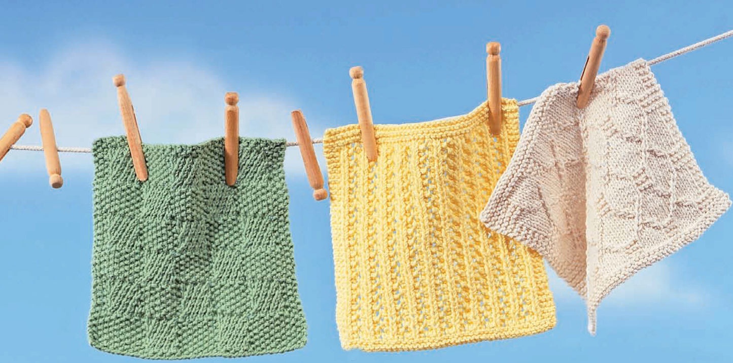 Leisure Arts’ Nifty Knit Dishcloths Digital Download features three beginner-friendly patterns in green, yellow, and cream. Displayed on a clothesline with wooden clothespins, they’re perfect inspiration for new knitters.