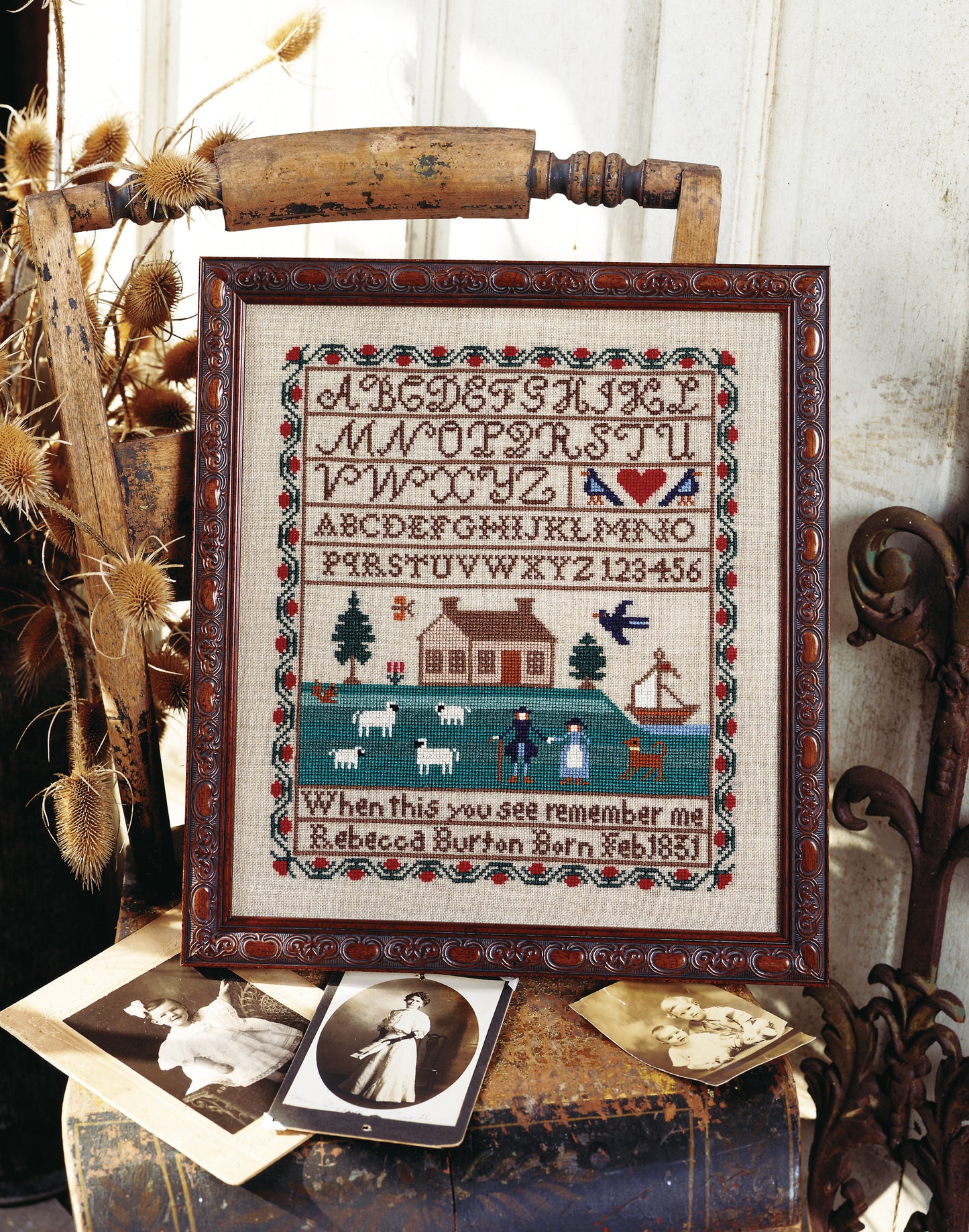 The A Sampling of Tradition Cross Stitch Digital Download by Leisure Arts features alphabets, numbers, motifs, and a pastoral scene—a timeless design reminiscent of antique samplers for your next stitching project.