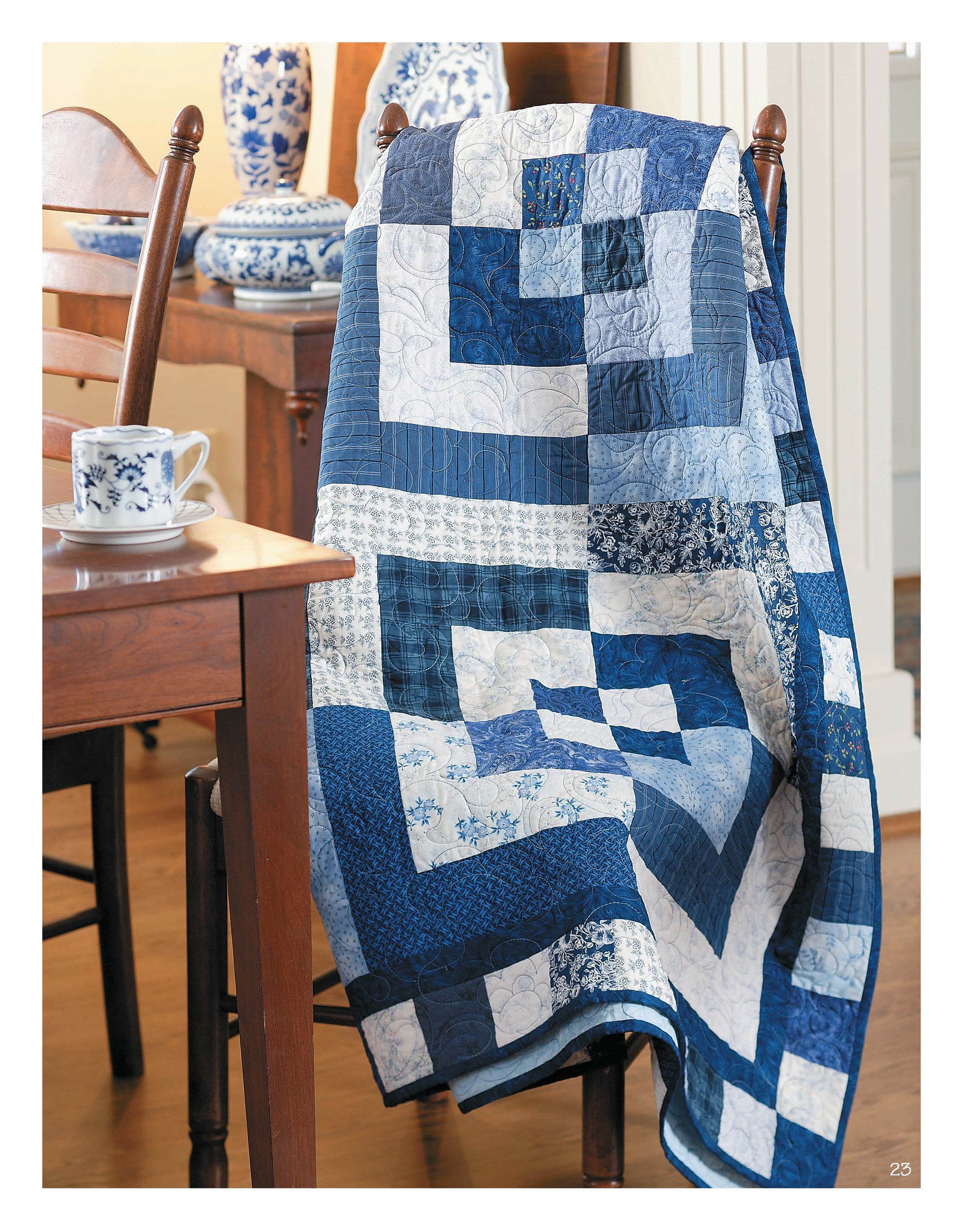 The Slash Your Stash Quilts Digital Download by Leisure Arts inspires a cozy, homey vibe—imagine blue and white patchwork on a chair by china and tea, perfect for trying fast piecing techniques at home.