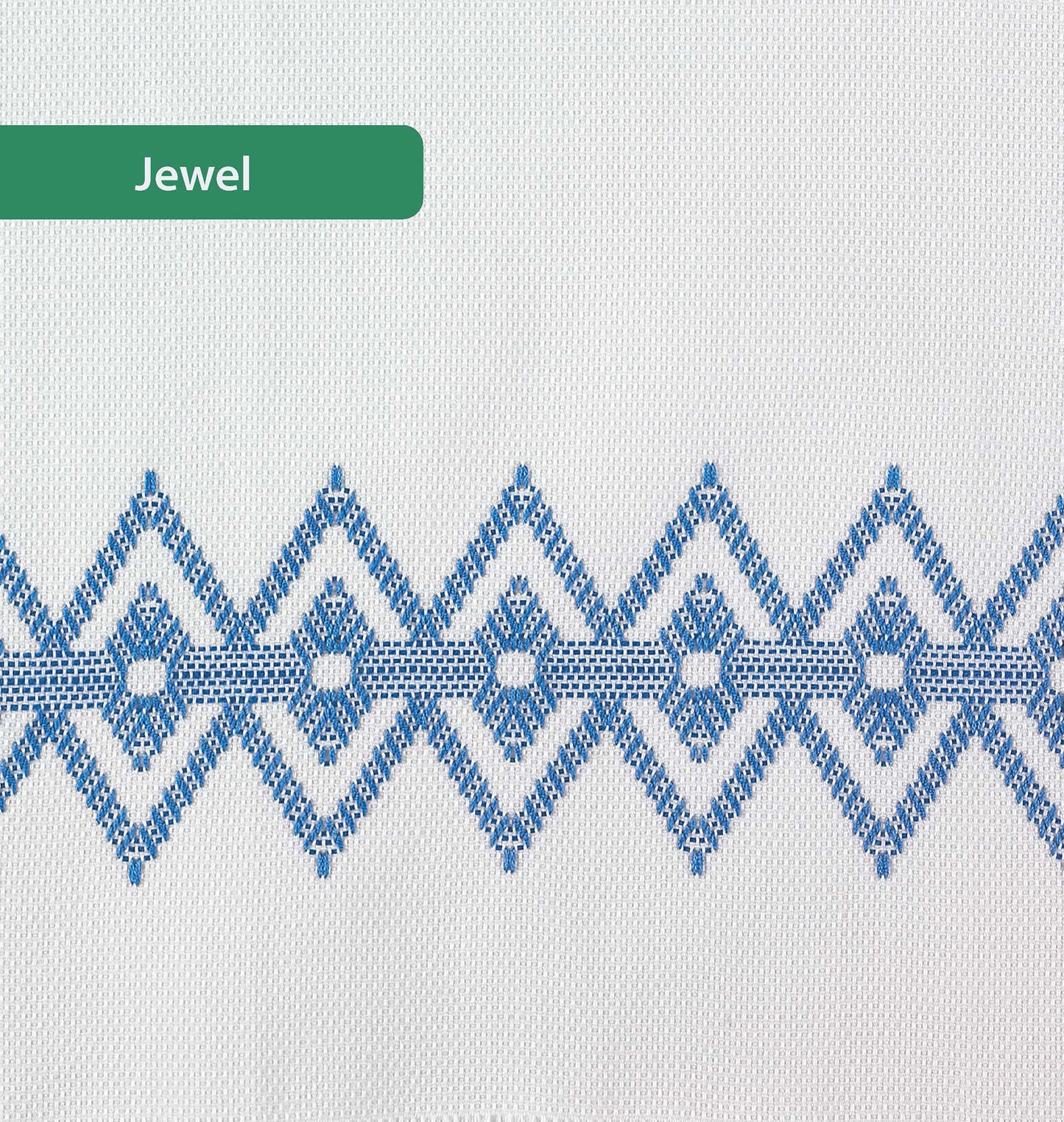 A geometric blue Swedish Weave embroidery of diamond and star shapes decorates these Easy-Does-It Swedish Weave Towels by Leisure Arts, with a green "Jewel" label highlighting the intricate floss work on white fabric.