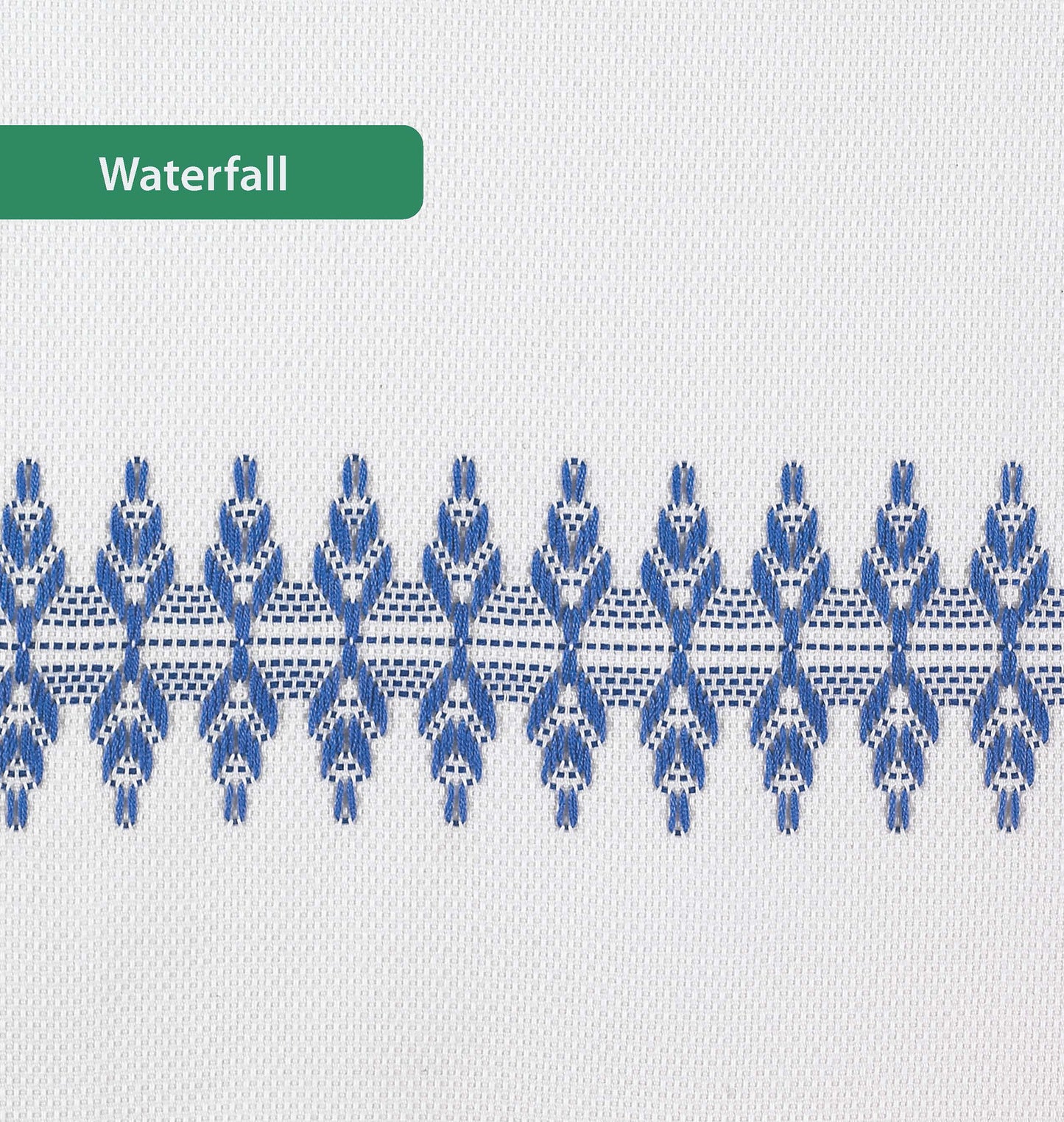 A white towel from Leisure Arts' Easy-Does-It Swedish Weave Towels features a horizontal row of blue embroidery and a green Waterfall label. Ideal for sparking inspiration for your next embroidery floss project.