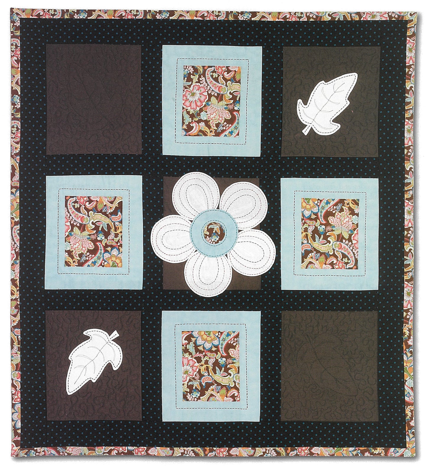 The iQuilt: No Holds Barred Designers' Mix by Leisure Arts is a fat-quarter friendly quilted wall hanging with nine floral and solid squares, leaf shapes, a central flower, and a multicolored floral border—ideal for creative quilting projects.