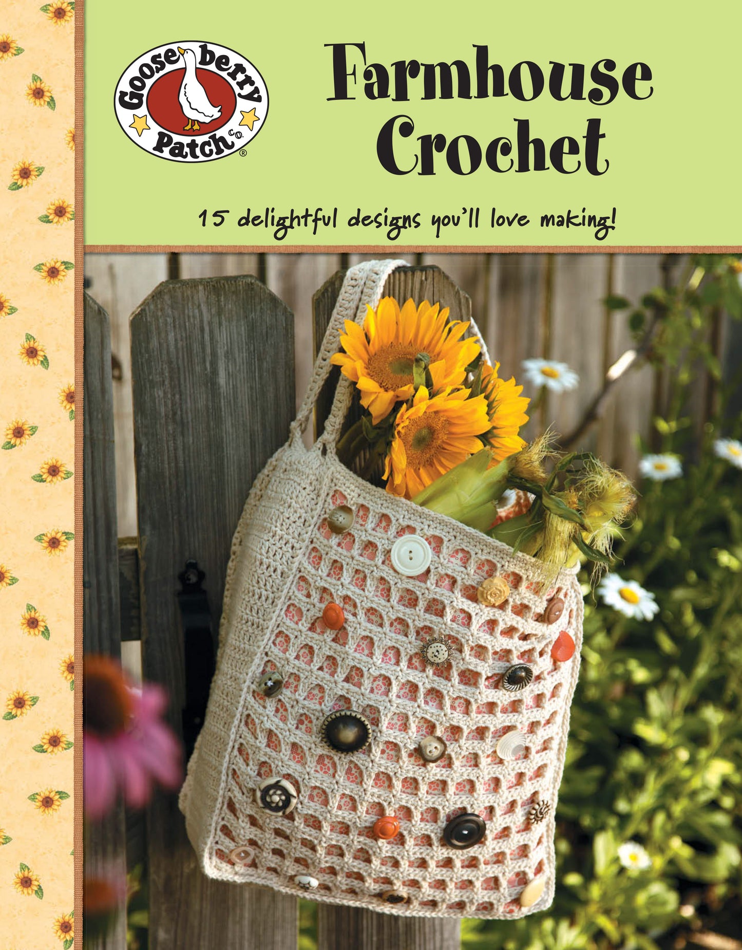 A crocheted tote with buttons and sunflowers rests on a wooden fence. The Gooseberry Patch Farmhouse Crochet Digital Download by Leisure Arts features 15 beginner-friendly crochet patterns for creative inspiration.