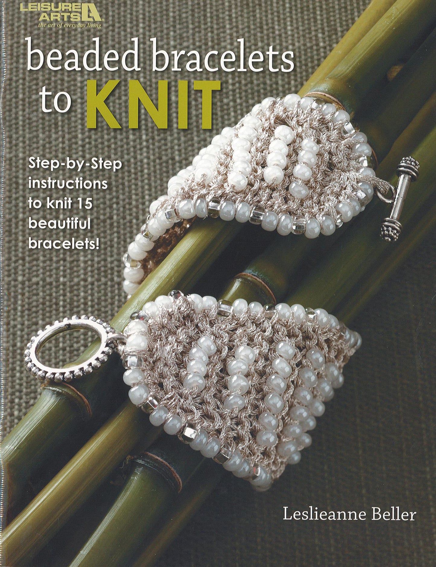 The cover of Beaded Bracelets to Knit by Leisure Arts shows two beaded knit bracelets on bamboo and highlights beginner-friendly, step-by-step instructions for 15 bracelet designs.