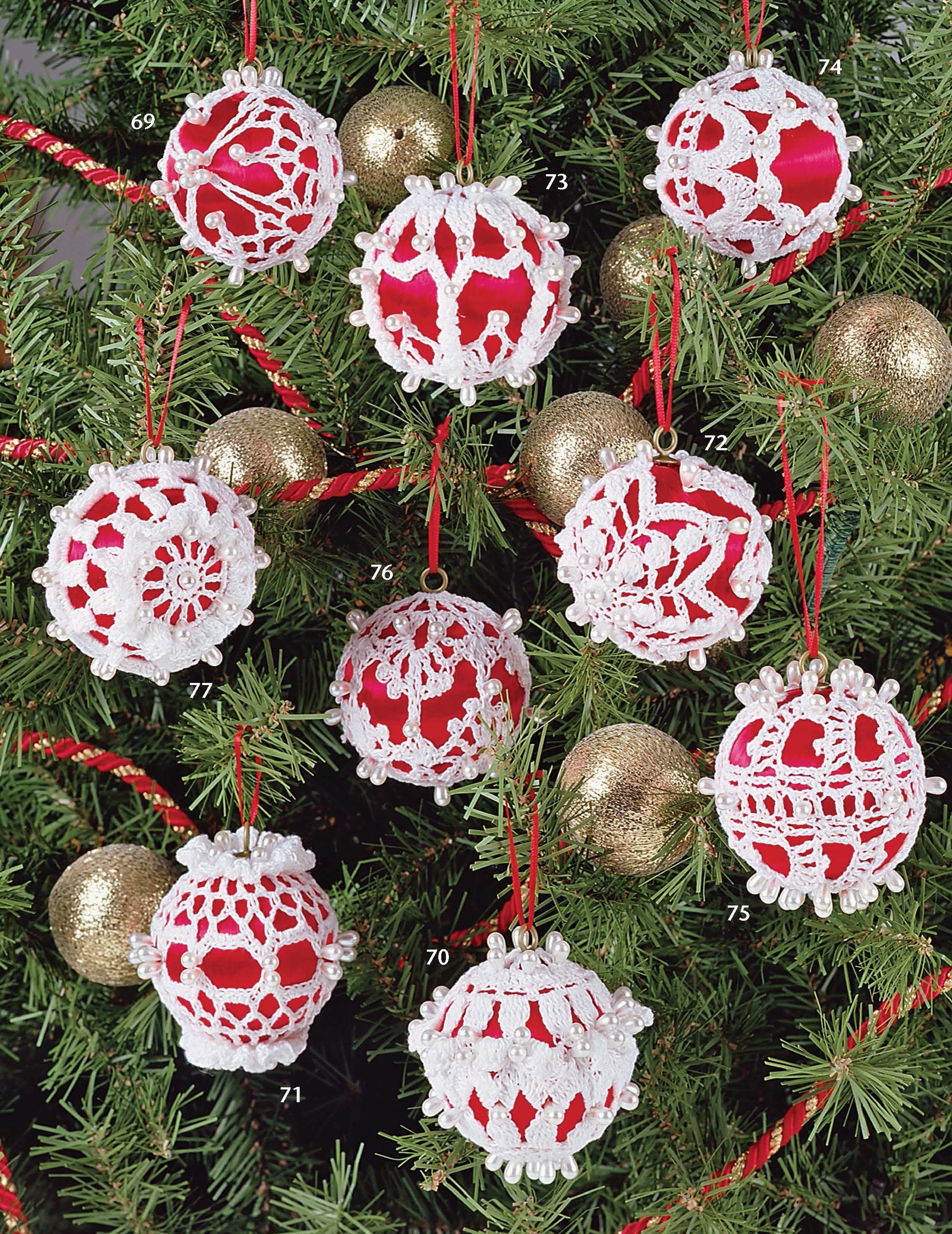 Leisure Arts' Big Book of Thread Ornaments features red Christmas ornaments with intricate crochet designs, each numbered for reference, hanging on a green tree alongside gold glitter balls and a red garland.
