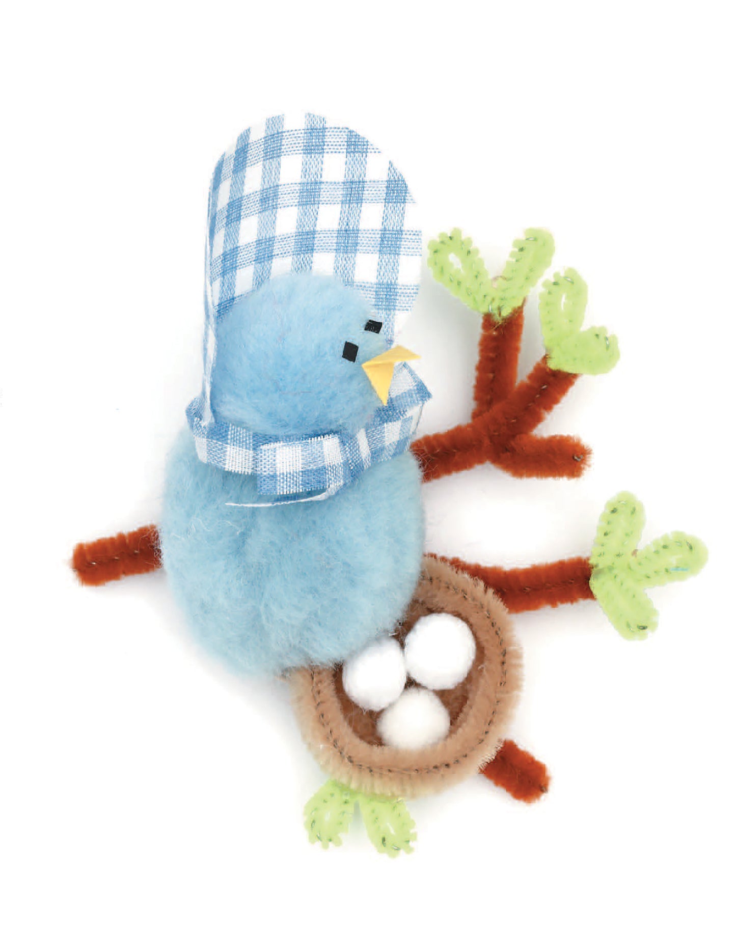 The Leisure Arts Pom-Pom Magnets set features a soft blue bird with a blue-and-white checkered bonnet perched on a brown-green branch next to a tiny nest holding three white eggs.