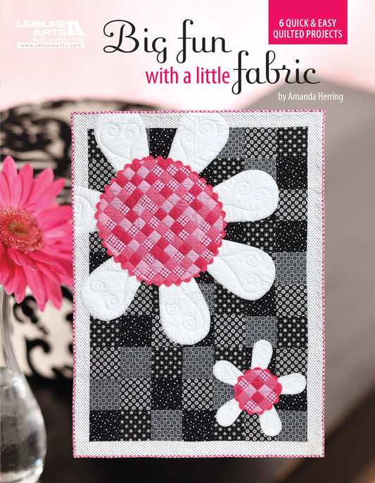 Book cover for Big Fun with a Little Fabric by Leisure Arts, featuring large white flowers with pink checkered centers on a black and white background—ideal for applique quilt enthusiasts.