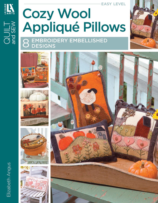 Cover of Cozy Wool Applique Pillows by Leisure Arts, featuring photos of embroidered autumn and nature-themed pillows on a rustic bench. Smaller images showcase more home décor pillow projects.