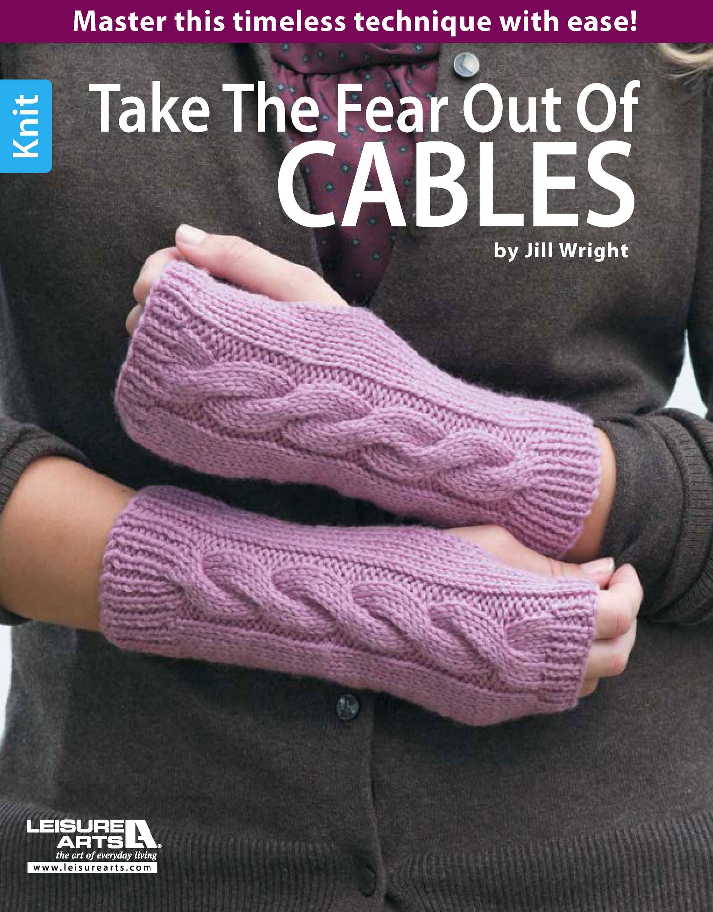 Wearing hand-knitted, light purple fingerless gloves with a cable pattern. Text: Take the Fear Out of Cables Knitting by Leisure Arts—your essential guide to mastering beginner cable knitting patterns with confidence!.