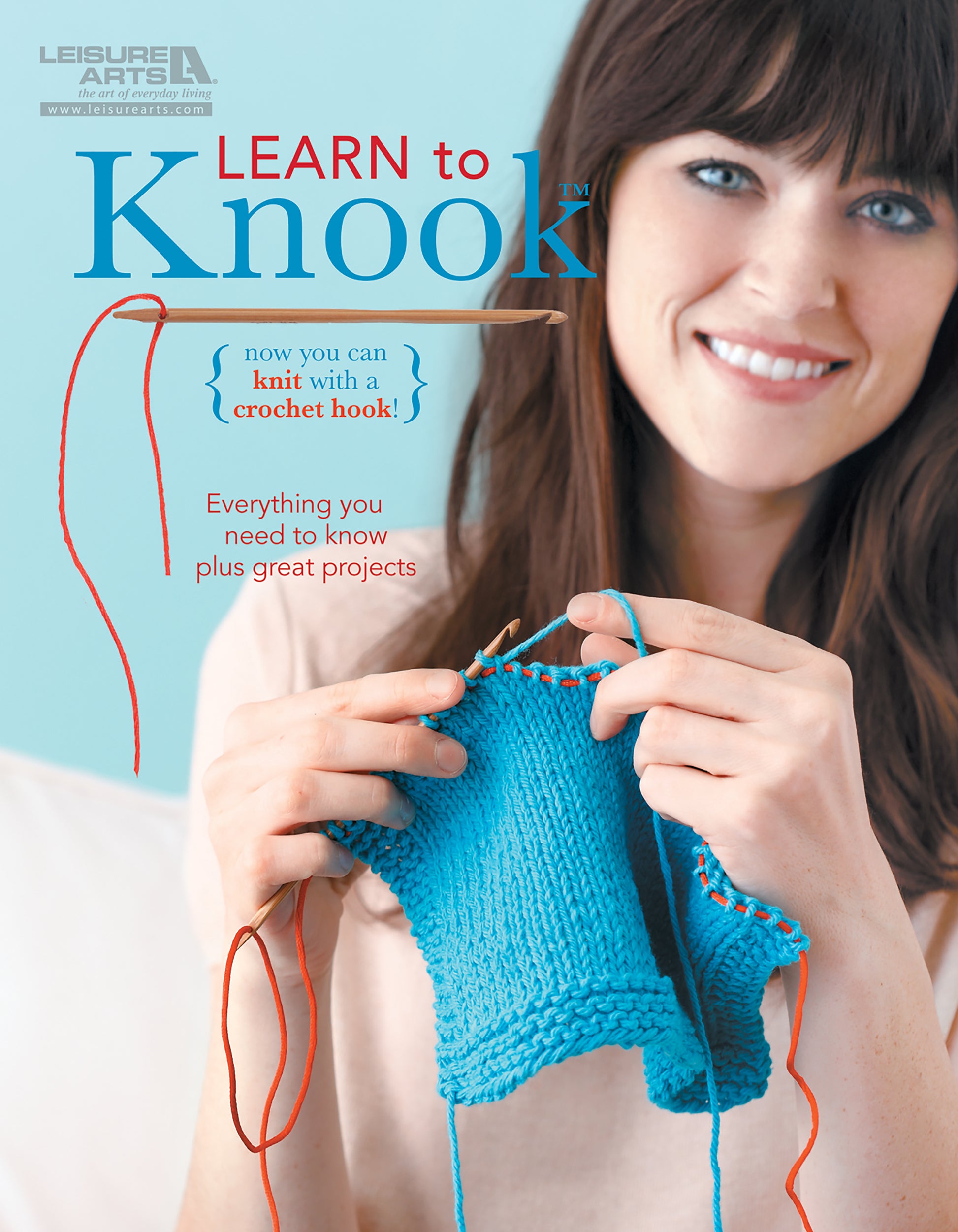 A woman smiles while using the Leisure Arts Learn to Knook tool, holding a blue knitted piece with a red cord. The text reads: Learn to Knook—essential knit fabric techniques and projects for your beginner crochet kit!.