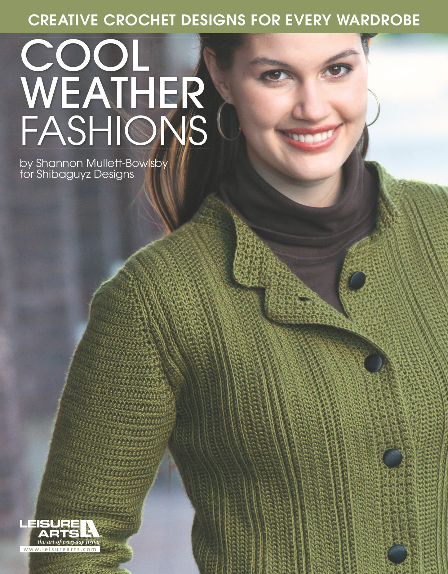 Smiling woman models an olive-green crochet cardigan with black buttons by Leisure Arts. Cool Weather Fashions offers creative crochet patterns and stylish designs for every wardrobe.